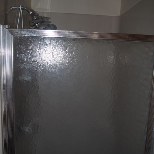 Bathroom:  small, but full bathroom, with entrance from the living room. Includes sink, mirror, toilet, and shower.