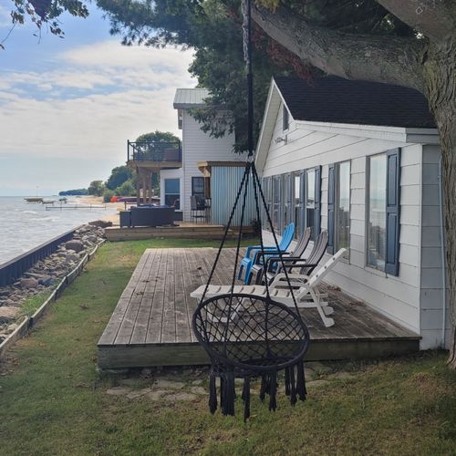 Exterior:  the private swing, deck, and beach at the beach house.