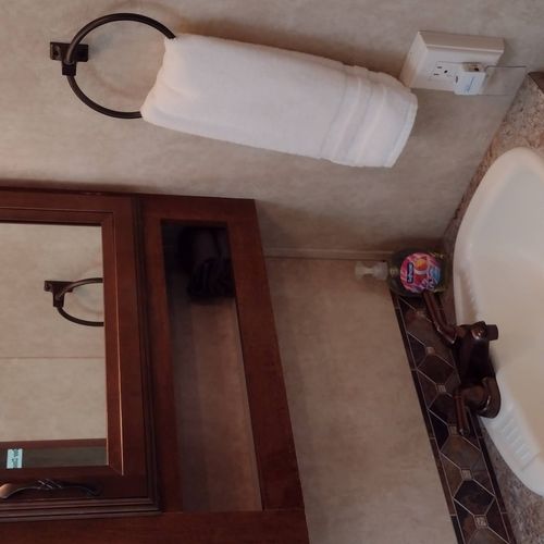 Bathroom #2:  full bathroom with a shower, sink, vanity, and toilet.