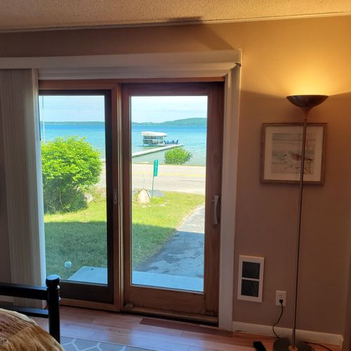 Bedroom #2 (first floor):  features a full-size bed, two closets, television, private entrance, and a great view of crystal lake!