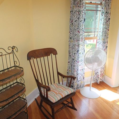 Bedroom #4 (second floor):  this very cute upstairs bedroom features two twin-size beds, a nightstand, lamp, pedestal fan, chair, and a large walk-in closet.
