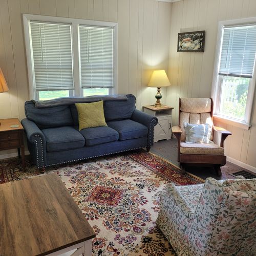 LIVING ROOM:  Very comfy and cozy living room with 2 sofas, a rocking chair, coffee table, and streaming television.