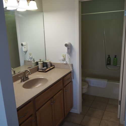 Master bathroom:  this is the private en-suite bathroom for the master bedroom. It's a full bathroom with a combination tub and shower. Note that there is a door that separates the combination tub / shower and toilet from the rest of the bathroom.