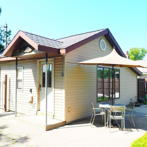 Exterior:  the side and back of the house in summer.