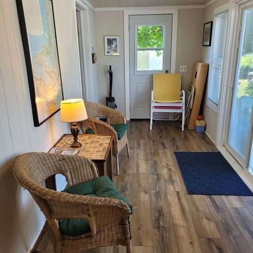 SUN PORCH:  The home has a fully enclosed sun porch with a nice view of Crystal Lake!
