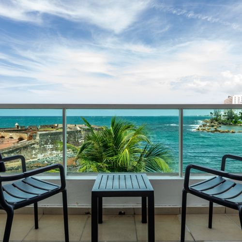 Your private balcony with stunning views of the historic fort and sparkling ocean. Perfect for morning coffee!