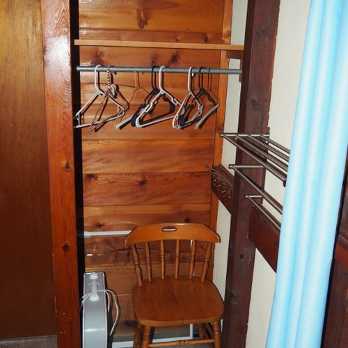 Bedroom #2:  features a full-on-full bunk bed, dresser, closet, and chair.