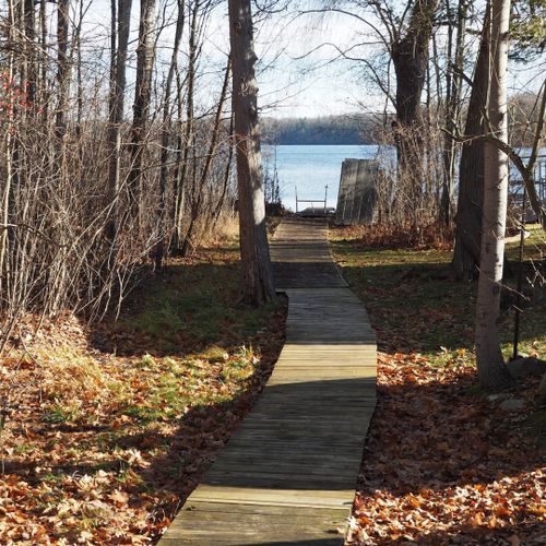 This is the walkway down to the private lake access area on green lake. The walkway is about 100 yards north of the house along betsie river road.
