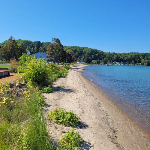 EXTERIOR:  Beulah Beach on a quiet day in September, with Cold Creek emptying into Crystal Lake in the middle of the beach
