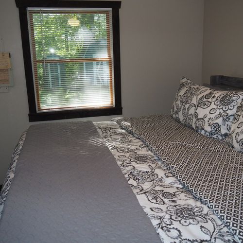 Bedroom #1 (main floor):  features a king-size bed, ceiling fan, dresser, mirror, closet, and a private television with live streaming via roku.