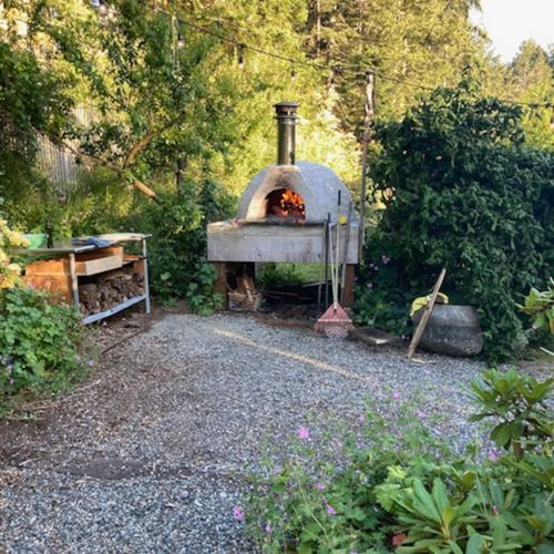 Fire up the wood-fired oven and make an evening of it.  This cozy garden spot is perfect for homemade pizza, fresh air, and gathering around the fire as the forest settles in for the night.