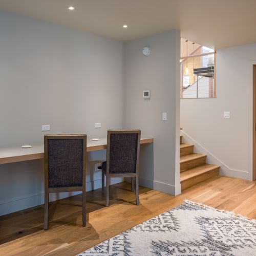 Head downstairs to the dedicated work bench with three chairs, plenty of USB plugs, and outlets.  Fiber Optics WiFi means fast speeds all day long!