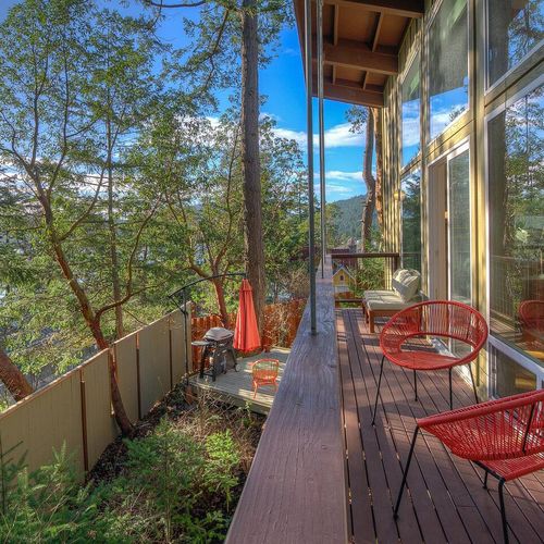 Views of the fenced yard below and BBQ area.