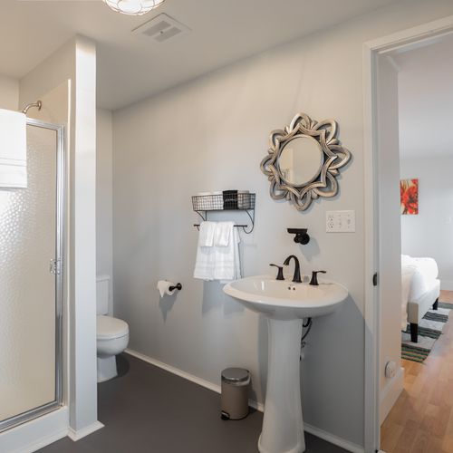 Downstairs bedroom ensuite with a shower and sink.