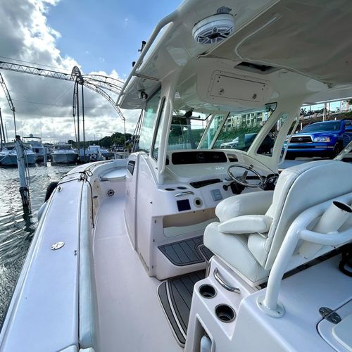 Vibrant marina scene under a brilliant sky! Enjoy the charm of a bustling dock with an array of boats and serene waters.