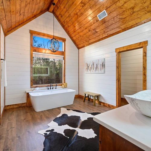 The private Master Bath houses a soaking tub AND a walk-in shower.