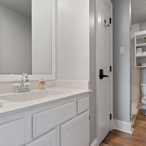 Full bathroom on the second floor w/ sink & clean white finishes.