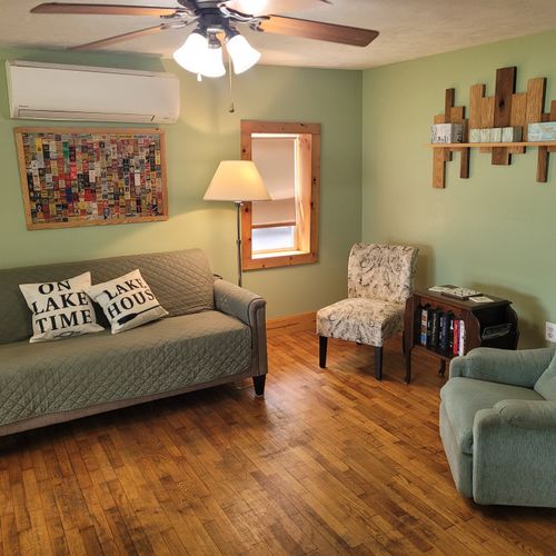 Living room:  the living room with the couch and two chairs