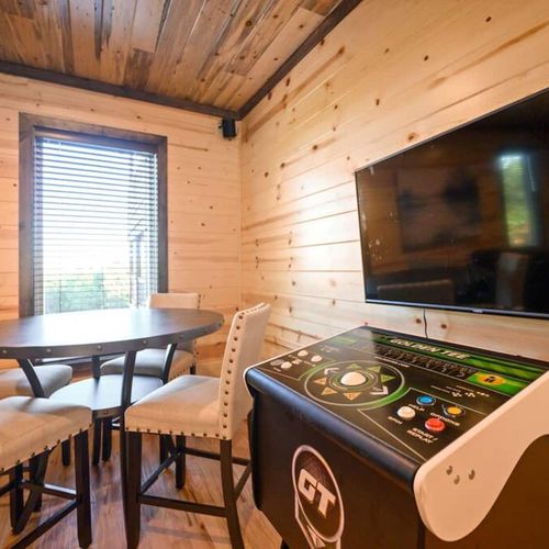 Arcade games and a table for cards.