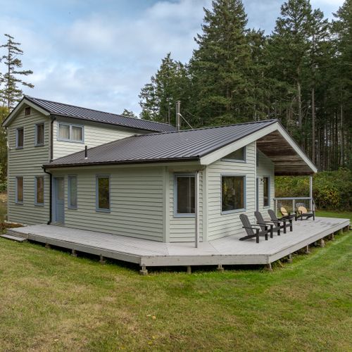expansive wrap-around deck for relaxing in the sun, and easy access to the yard.