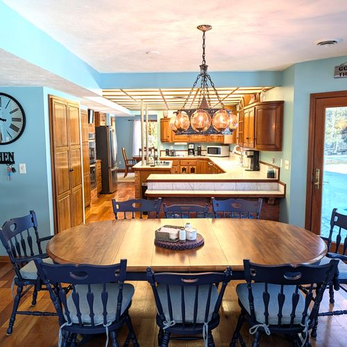 DINING AREA #1:  There is a casual, family-friendly dining area between the kitchen and the living room with seating for up to 8 adults.