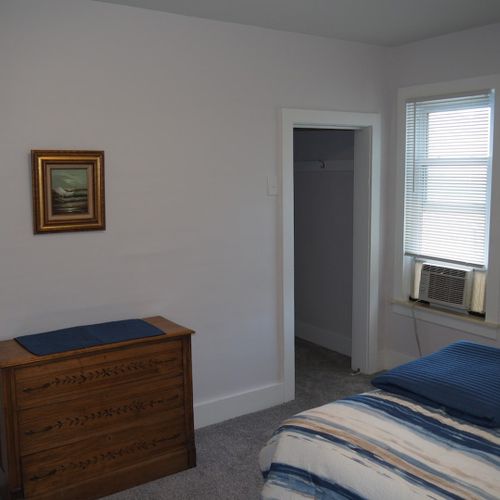 Bedroom #1:  all 3 bedrooms are upstairs. This bedroom features a queen-size bed, nightstands with lamps, dresser, chair, and a large closet.