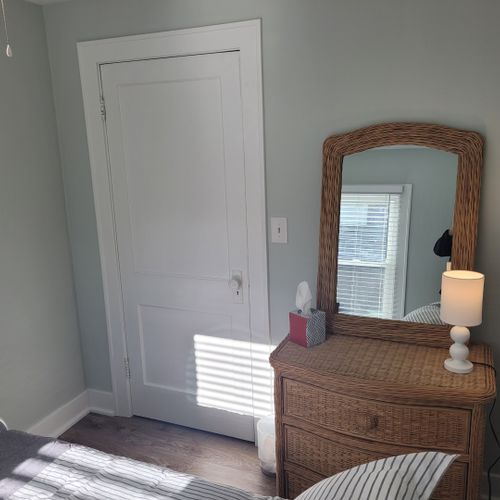 Bedroom #2:  features a full-size bed, dresser, mirror, and closet.