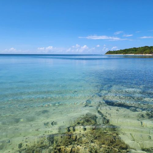 Immerse yourself in tranquility! Enjoy the breathtaking clear turquoise waters and pristine coastline of Malolos, perfect for a peaceful escape.