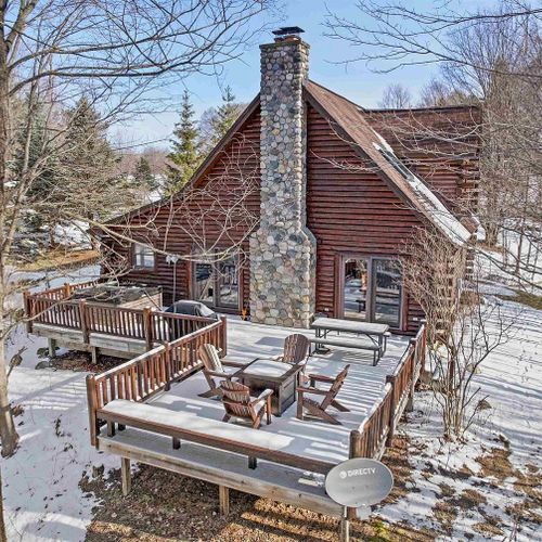 Exterior:   an aerial photo of the huge backyard deck in winter.