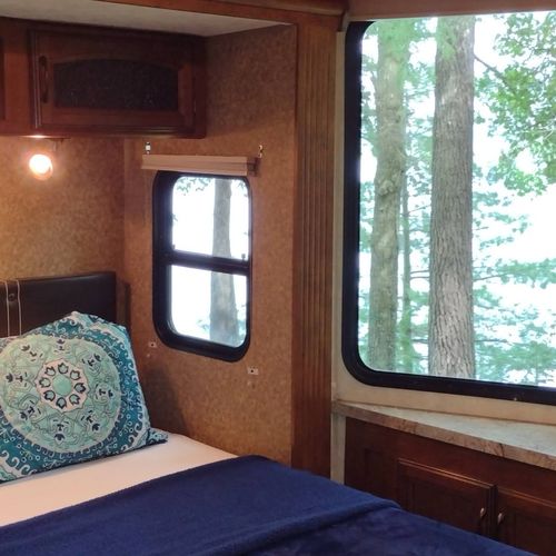 Bedroom #1:  features a queen-size bed, dresser, and a great view of little platte lake.
