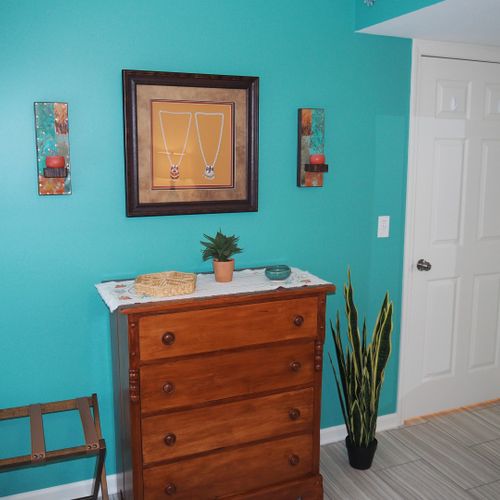 Bedroom:  very comfortable bedroom with a queen-size bed, ceiling fan, dresser, and mirror.