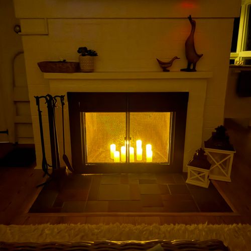LIVING ROOM:  The beautiful electric candles in the fireplace at night