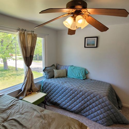 Bedroom #2 ( second floor):  features a full-size bed, a twin bed, a ceiling fan, and a closet.