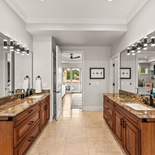 Boutique hotel energy—oversized mirrors and clean design.