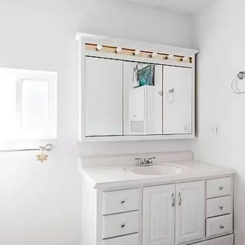 Spotless white bathroom designed for a fresh, clean feel.