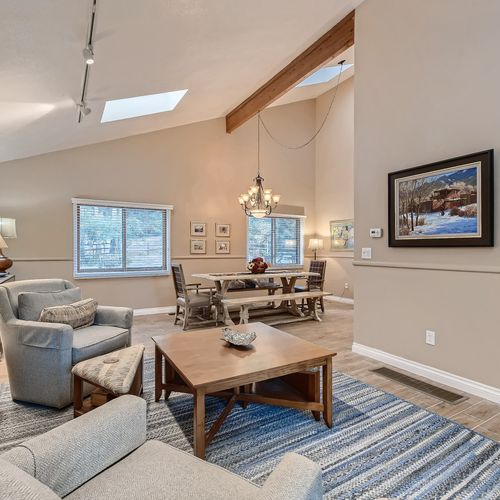 The open concept living room/dining room area provides the perfect space for you and your group to get cozy.