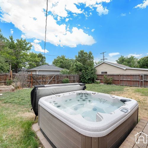 Relax and unwind in our luxurious hot tub, nestled in a private, fenced backyard.