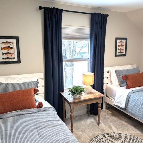 BEDROOM #2 (SECOND FLOOR):  Cute bedroom with two twin beds, table, lamp, dresser, and closet.