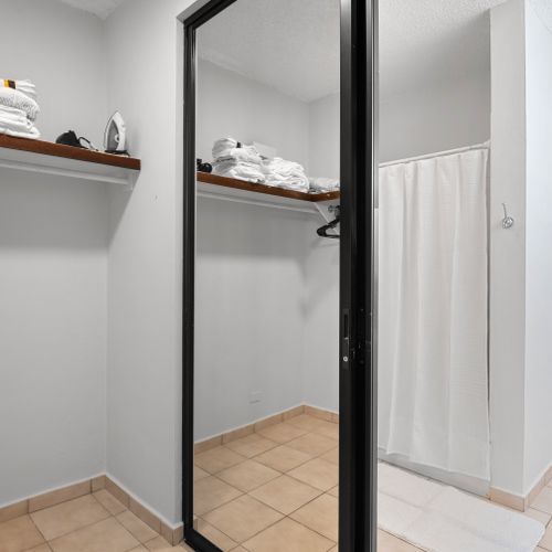 Ample closet space with built-in shelving to keep your belongings organized throughout your stay.