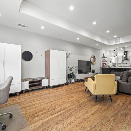 Ample living room storage with practical details throughout the space.