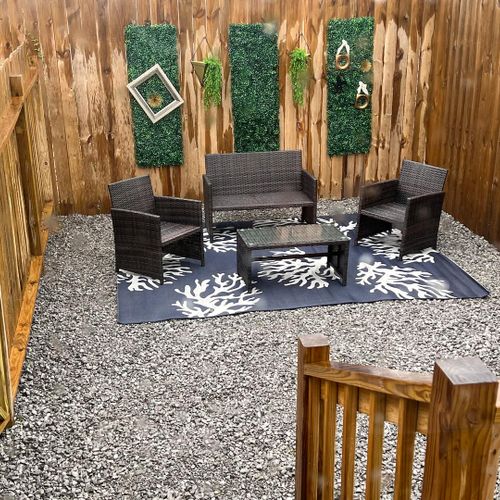 Relax in the shaded backyard seating area, ideal for morning coffee or an evening chat.