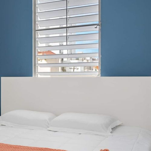 Wake up refreshed and ready to explore in this bright bedroom.