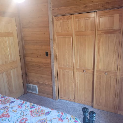 Bedroom #2:  the second of the two cute and comfy downstairs bedrooms with a queen bed, a closet, and a ceiling fan