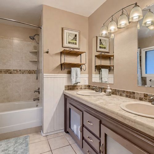 There is also a private ensuite bathroom with double-vanities and a shower/tub option.