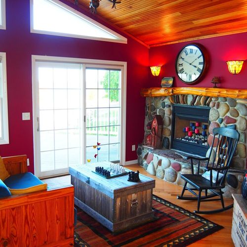 Upstairs foyer:  very cute upstairs foyer with a door out to the deck. (note that the fireplace is not for guest usage. )