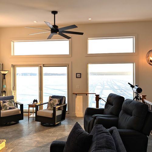 LIVING ROOM (UPPER LEVEL):  The home has an exquisite living room on the upper level (third floor) with a spectacular view of Crystal Lake!  PLEASE NOTE THAT THE FIREPLACE IS NOT AVAILABLE FOR GUEST USAGE.