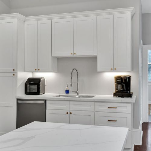 Modern and minimalist kitchenette with all the essentials for your stay. Featuring ample storage, a deep sink, and stainless steel appliances, this space is perfect for preparing a quick meal or brewing your morning coffee.