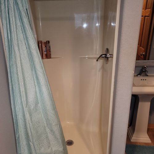 BATHROOM #2 (MAIN FLOOR):  This is a full common bathroom on the main floor with a walk-in shower.  Also has a stacked washer and dryer in it.