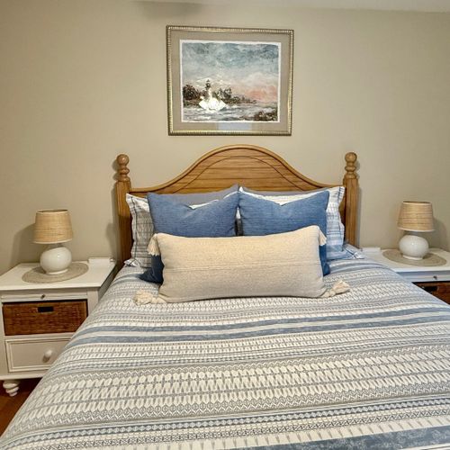 Bedroom #2:  features a queen-size bed, ceiling fan, closet, nightstands, and lamps.