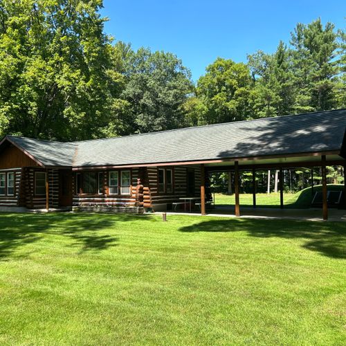 Exterior:  another view of the front of the cabin in summer.